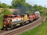 A pair of Dash-8's (BCOL 4611 - CN 2024) leading 78 cars on CN M33131 31 at Garden Ave