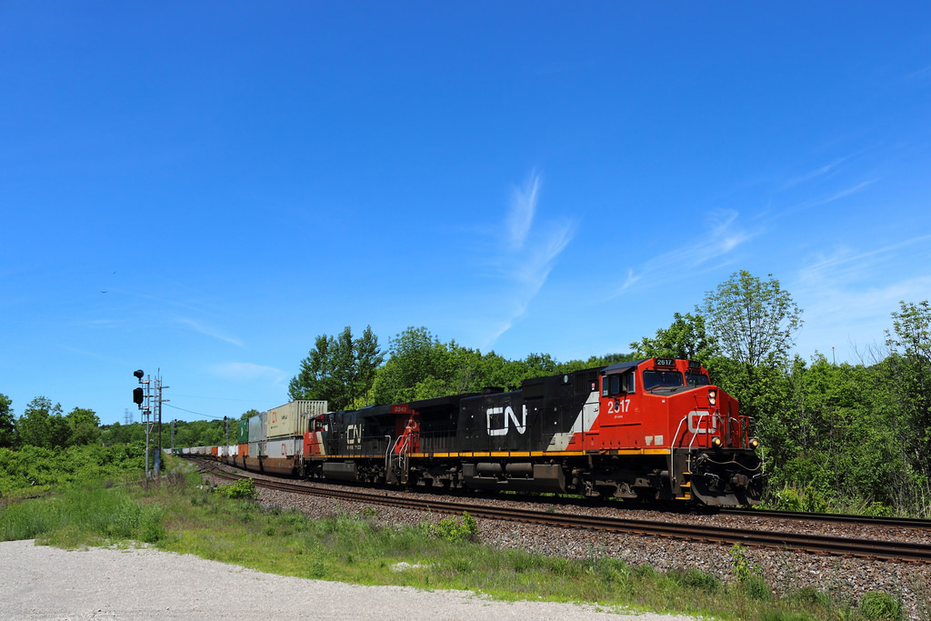 While I was planning to spend the whole day at the Laking Gardens footbridge for the annual junction meet, the move to the cowpath was required for better lighting conditions. Not long after our arrival, both CN 149 and VIA 72 roll by within minutes of eachother making for some nice shots. This was actually my first time shooting at the cowpath, and it definitely won't be my last. This is my second uploaded shot for the evening of the meet, and many more should be coming soon.