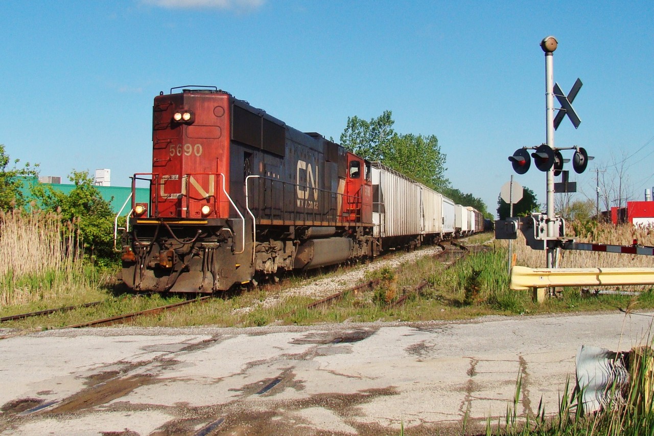 A late running freight out of Van de Water is seen here at the present day location where the rails end, however this day the train will continue another 48 track miles to Fargo to connect to the CSX Sarnia Sub. I remember having this day off of school and work and contemplating chasing this train through the county, but instead went and chased the ETR around Windsor. 
Today the ETR is still doing the same thing and the CASO is a gravel path slowly being reclaimed by nature.