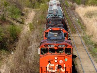 After a nice day up north on the CN Bala Subdivision, I head down to the York with the knowledge that there is a Cn 570 somewhere out there today. Only after a mere 10 minutes go by, 570 passes by with a trio of roaring geeps on it's way back to CN's Macmillan Yard. This is the first photo I have uploaded to the site for a while now, and I hope to publish many more very soon.