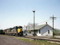 The third of the series of shots of Merlin in May 1964, here's a clearer view of the Chesapeake and Ohio Merlin Station and surrounding area. In the scene are semaphore signals, train hoops, MofW boxcars, a bicycle leaning on the side of the station, and of course the 3-pack of nearly new EMD GP30's. C&O 3021 is leading this eastbound, waiting on a meet with a C&O westbound.
<br><br>
* View of the train and its three GP30's: <a href=http://www.railpictures.ca/?attachment_id=14844><b>http://www.railpictures.ca/?attachment_id=14844</b></a><br>
* Meeting the westbound with two sisters: <a href=http://www.railpictures.ca/?attachment_id=14951><b>http://www.railpictures.ca/?attachment_id=14951</b></a>