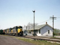 The third of the series of shots of Merlin in May 1964, here's a clearer view of the Chesapeake and Ohio Merlin Station and surrounding area. In the scene are semaphore signals, train hoops, MofW boxcars, a bicycle leaning on the side of the station, and of course the 3-pack of nearly new EMD GP30's. C&O 3021 is leading this eastbound, waiting on a meet with a C&O westbound.
<br><br>
* View of the train and its three GP30's: <a href=http://www.railpictures.ca/?attachment_id=14844><b>http://www.railpictures.ca/?attachment_id=14844</b></a><br>
* Meeting the westbound with two sisters: <a href=http://www.railpictures.ca/?attachment_id=14951><b>http://www.railpictures.ca/?attachment_id=14951</b></a>