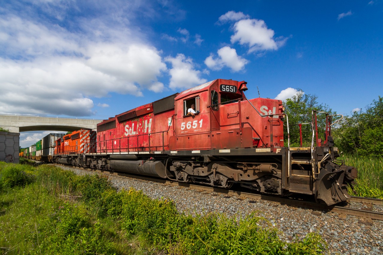 The STL&H Lives!More than twenty years ago when Canadian Pacific was in a financial situation that was far more detrimental than it is today, the Saint Lawrence & Hudson was created to help guide the company away from it's woes. In the process, 32 of Canadian Pacific's locomotives received fresh STL&H paint. One of these locomotives was 1972 built SD40-2 # 5651, which on April 16th 1997 received a complete overhaul and repaint at Calgary's Ogden Shops. Surviving more than twenty years on the road despite the dissolution of the STL&H in 2001, 5651 stills earns it's keep for CP today. This morning, I was surprised when I received a timely text from a good friend that 5651 was leading train # 142, CP's Chicago-Montreal hotshot. After receiving a series of clearances and a pusher set complimentary of Kinnear Yard, 5651 is finally on the move (if ever so slowly) with fellow SD40-2 # 5926. As the aging duo of power grinds up the Hamilton Subdivision, they catch a nice patch of morning sunlight just north of Desjardins. It would be a long journey to Guelph Junction.