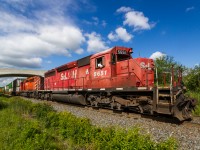 <b>The STL&H Lives!</b>More than twenty years ago when Canadian Pacific was in a financial situation that was far more detrimental than it is today, the Saint Lawrence & Hudson was created to help guide the company away from it's woes. In the process, 32 of Canadian Pacific's locomotives received fresh STL&H paint. One of these locomotives was 1972 built SD40-2 # 5651, which on April 16th 1997 received a complete overhaul and repaint at Calgary's Ogden Shops. Surviving more than twenty years on the road despite the dissolution of the STL&H in 2001, 5651 stills earns it's keep for CP today. This morning, I was surprised when I received a timely text from a good friend that 5651 was leading train # 142, CP's Chicago-Montreal hotshot. After receiving a series of clearances and a pusher set complimentary of Kinnear Yard, 5651 is finally on the move (if ever so slowly) with fellow SD40-2 # 5926. As the aging duo of power grinds up the Hamilton Subdivision, they catch a nice patch of morning sunlight just north of Desjardins. It would be a long journey to Guelph Junction.