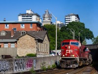 <b>Mac Attack!</b>After close to 8 years of shooting Canadian Pacific trains, I was finally able to photograph one of CP's ill-fated EMD SD90MAC's leading in good lighting! CP 9142 is seen bringing train 254 through the Hunter Street Tunnel in downtown Hamilton.