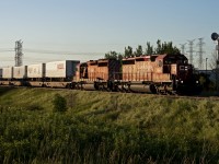 The daily expressway train charges through Ajax with a pair of SD40-2's for power.