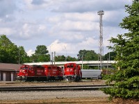 I knew that CP was going to spend a lot of money on Quebec street yard, but I didn't figure on them planting over a dozen large trees. Not only having removed much of the trees, shrubs, and debris along Central Ave, CP has also cleaned up much of the track supplies in the yard, moving them to a newly-fenced area at the west end. Here we see T29's power along with the London Pickup power (3027 and 3041, both recently rebuilt). Wouldn't that have been great to be one of the landscapers hired to plant those trees?!