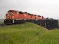 CP 463, the daily Moose Jaw-Eastport manifest, rumbles across the High Level Bridge in Lethbridge with a little under 100 cars in tow.