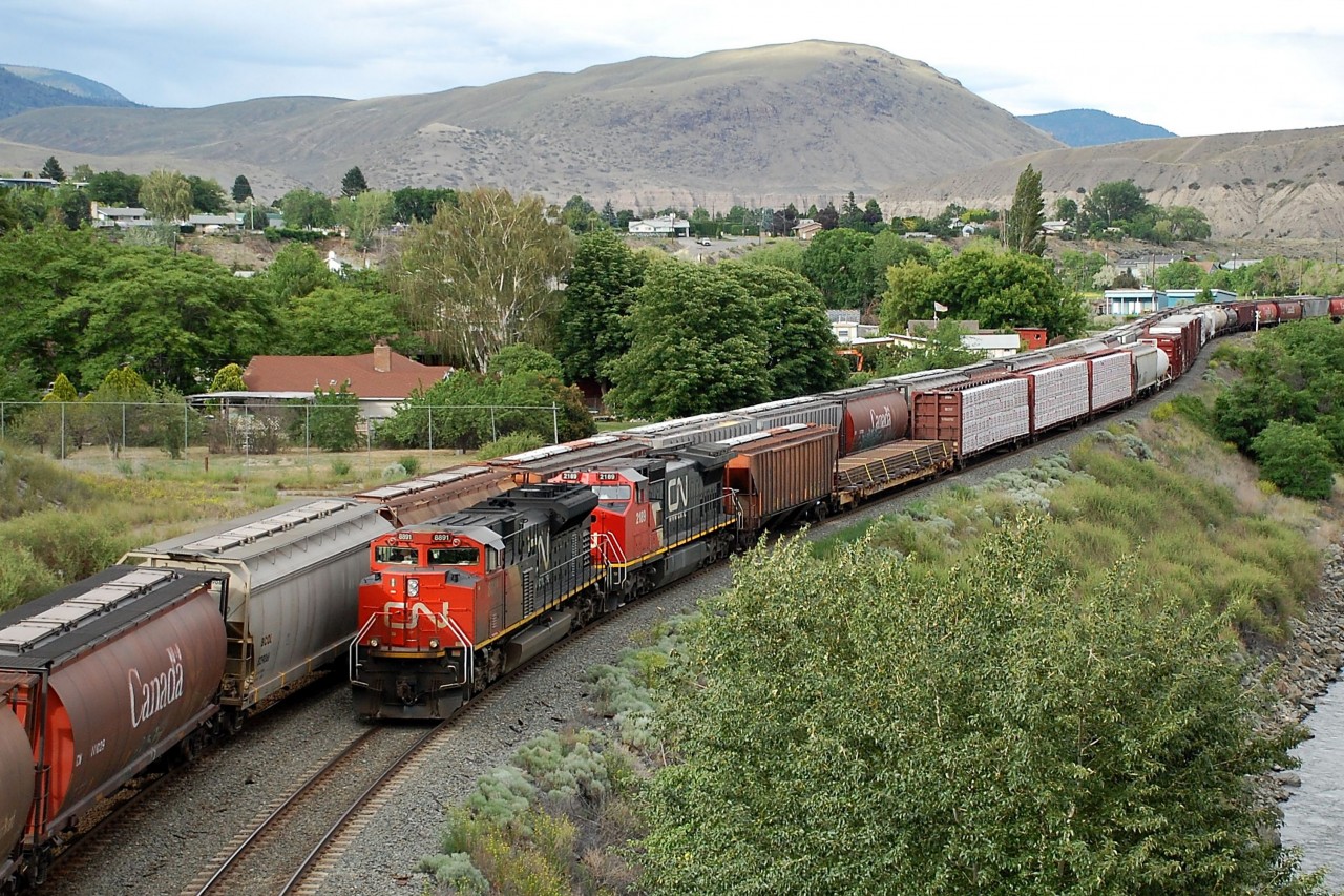 CN nos.8891 & 2189 are awaiting a couple of pass-bys before they can continue westwards with this mixed freight.