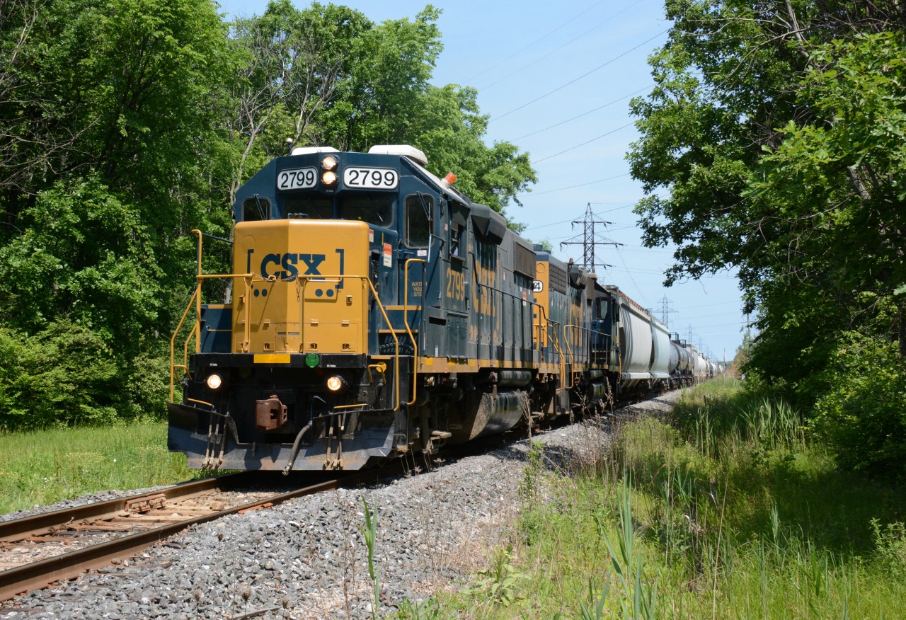 CSX2799 leads CSX2574 across Williams Dr. south of Sarnia, Ontario.