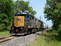 CSX2799 leads CSX2574 across Williams Dr. south of Sarnia, Ontario.