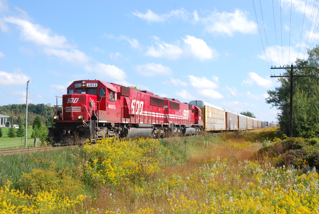 A sweet pair of candy-apple red SOO's head west for Rougemere Yard in Detroit, MI with traffic for CSX.