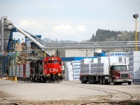 CN(WC)3026 is the lead unit of three that are picking up five cars of lumber @Tolko Industries in Lavington.