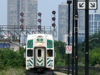 GO cab car 212 prowls the weed-grown Willowbrook Yard lead, heading through the north platform of Mimico GO Station out of service. Note how tightly the platform narrows in the background between the two tracks...I wouldn't want to be standing there when a VIA blows by at track speed!