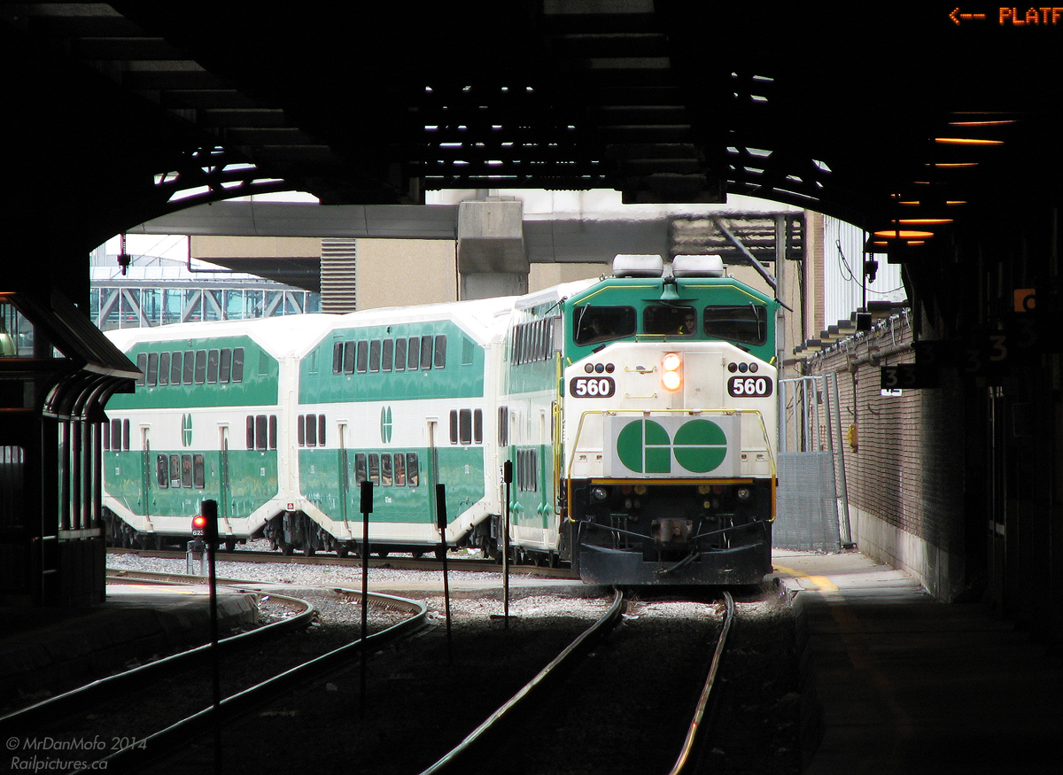 With its bell ringing and slowing for its station stop, GO F59PH 560 pulls afternoon train 266 from Brampton, unofficially known as the "Bramalea Flip", under the dark confines of Toronto Union Station's train shed on Track 1 (Platform 3). This trainset was in charge of a number of afternoon runs on the line between Union and Bramalea, culminating in a pre-rush hour trip all the way to downtown Brampton as 281, and then deadheading back to Toronto as equipment move 864 to go into service on the Stouffville line. Back in 2005 it was run with an L6 set (6 cars and a locomotive), but it eventually expanded to a full L10.

Decently patronized, the afternoon trains were later cancelled around April 2010 (and replaced by buses) to allow more track time for the West Toronto Grade Separation and other track work associated with upgrading the Georgetown corridor. The 281 run was retained, and shifted departure times and end destinations a number of times before becoming a regular pre-rush hour train all the way to Georgetown. 560, now rebuilt, is one of the few F59's left soldering on in GO service.