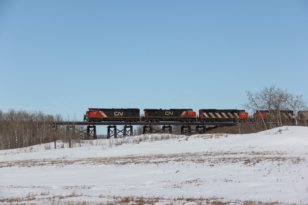 CN 2421 leads a westbound freight over the small trestle between Heath and Greenshields on CN's Wainwright subdivision.
