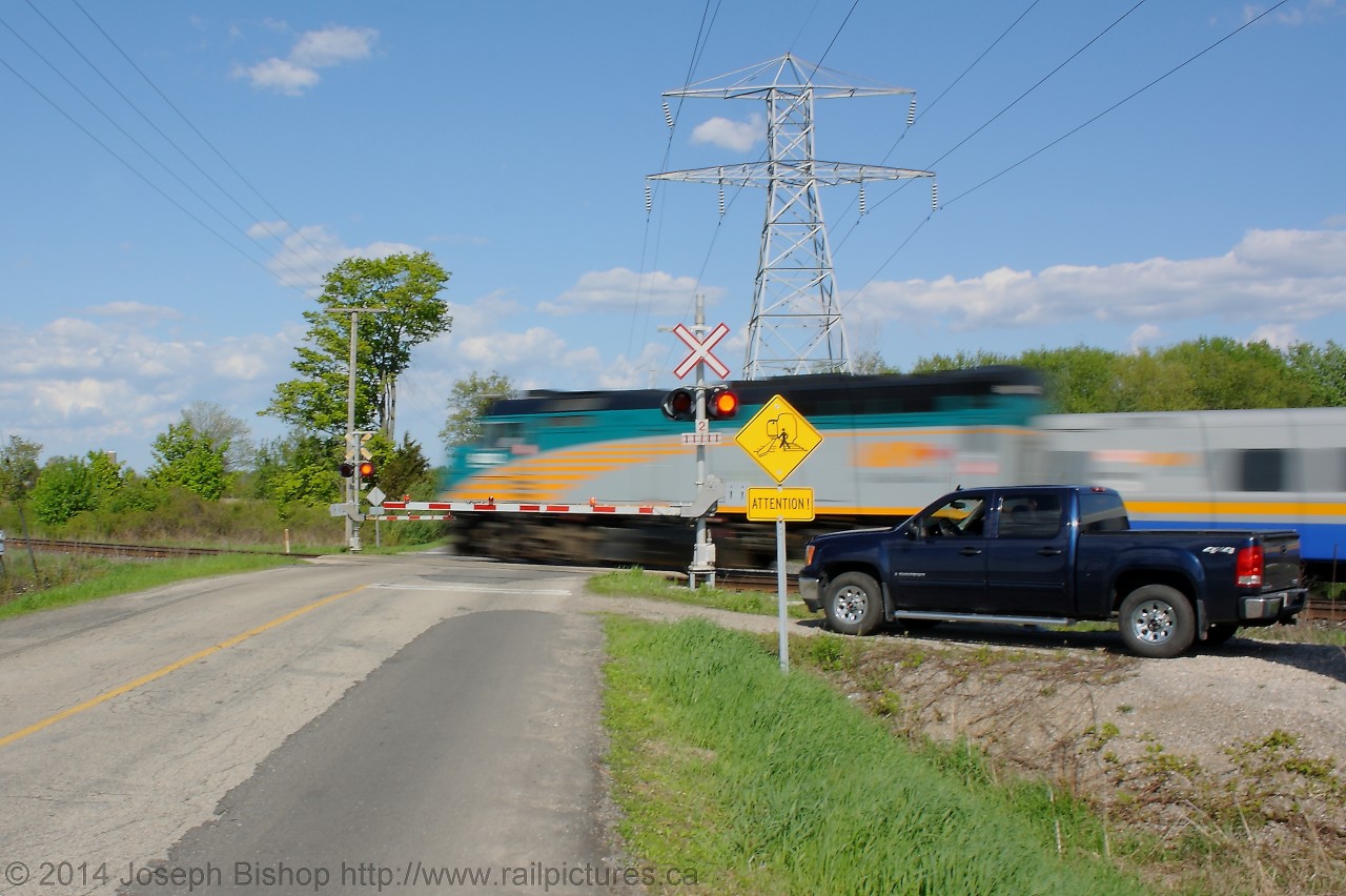 A More Human Way To Travel  Via Train 76 streaks past Powerline Road on the outskirts of Brantford on their way to Toronto.