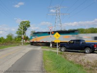 <b>A More Human Way To Travel</b> <br> Via Train 76 streaks past Powerline Road on the outskirts of Brantford on their way to Toronto.  