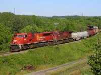 CP 254 eases through the S curves approaching Des Jardins with CP 9142 and CP 9578 working hard to hold their train back on the grade.