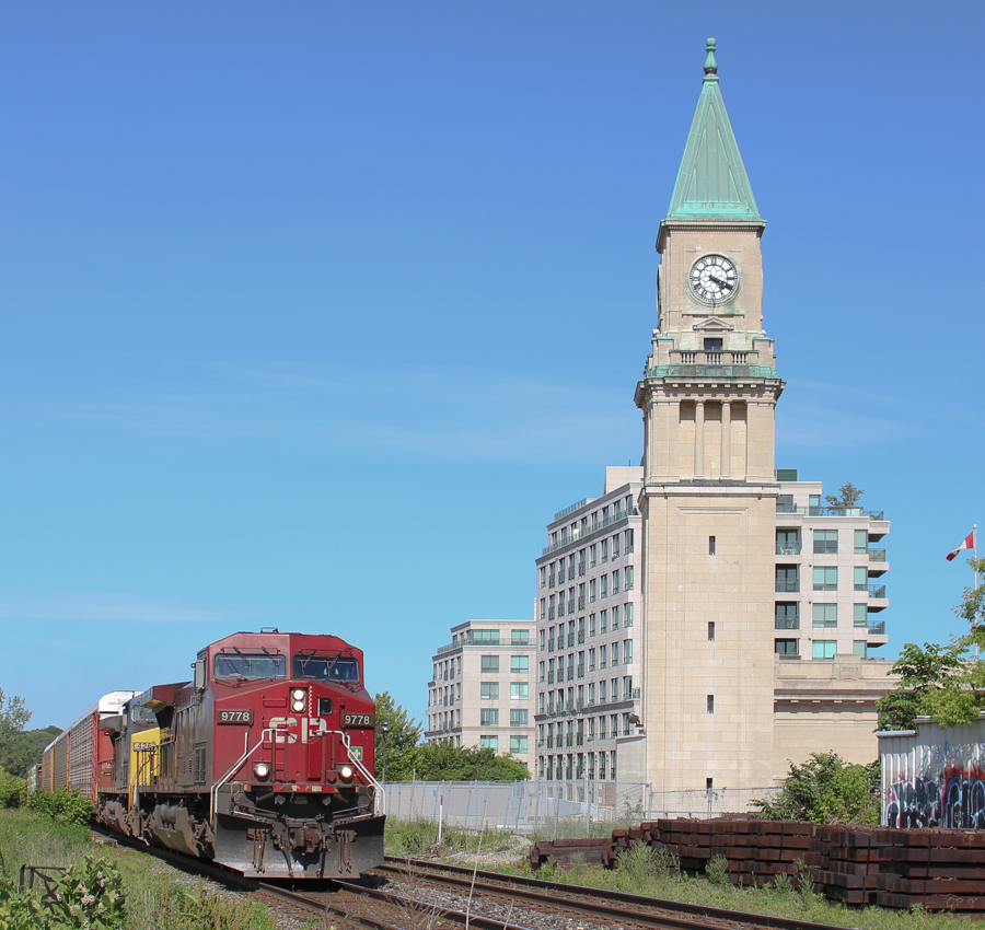 On what normally is a quiet Sunday late afternoon, CP 243 is the third train in just 17 minutes, passing the clock tower as it reads 4:21PM. Two AC4400CW's (the second being CSX 426) lead this medium sized manifest past the old Summerhill train station with its prominent clock tower. Built in 1916 when this was considered the north end of the city, this station had the potential to become a massive city hub, and the pride of CP. These dreams were vanquished after Union Station was built, and the Great Depression ultimately closed it in 1930, however the entire structure still stands after 98 years.