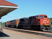 9:50 and an early running oil train heading directly into the strong morning sun. CN 8802 BNSF 8005 and BNSF 5275 are in charge of the long train.