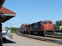 10:43 CN 5686 & CN 2632 lead an all intermodal 148 east into the bright sun.