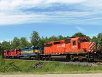 11:06 at highway 3 crossing to the north of Drumbo town centre near the pond. CP5909, DME 6091, CP 2228 and CP 2263 lead an eastbound mixed freight that had a piece of everything! 