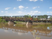 Another load of rail taken off the Drumheller Sub, crossing over the murky Red Deer River. Train will stop in the town for the night before heading west to Calgary. 