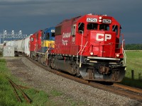 A nice EMD lashup of CP 6256-DME 6091-CP 6231 departs Wolverton with some dark rain clouds in the background.