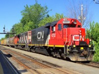 CN-4732 a GR-420-B leading loco with CN-4769 a GR-420-C pulling a covoy of mix cars going to eastern Québec  the cn 4732 nice and new paint and running good by the sound et was given more speed in front of us 