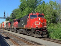 The CN-2634 a EF-644-D leading loco follow of CN-2509 C-44-9WL and CN-5536-SD-60-F the covoy coming out of the divert bridge on left side du of a ship in ST-Lambert lock (écluses)the convoy going to the maritimes on a milk run onis way up to Halifax N.S.