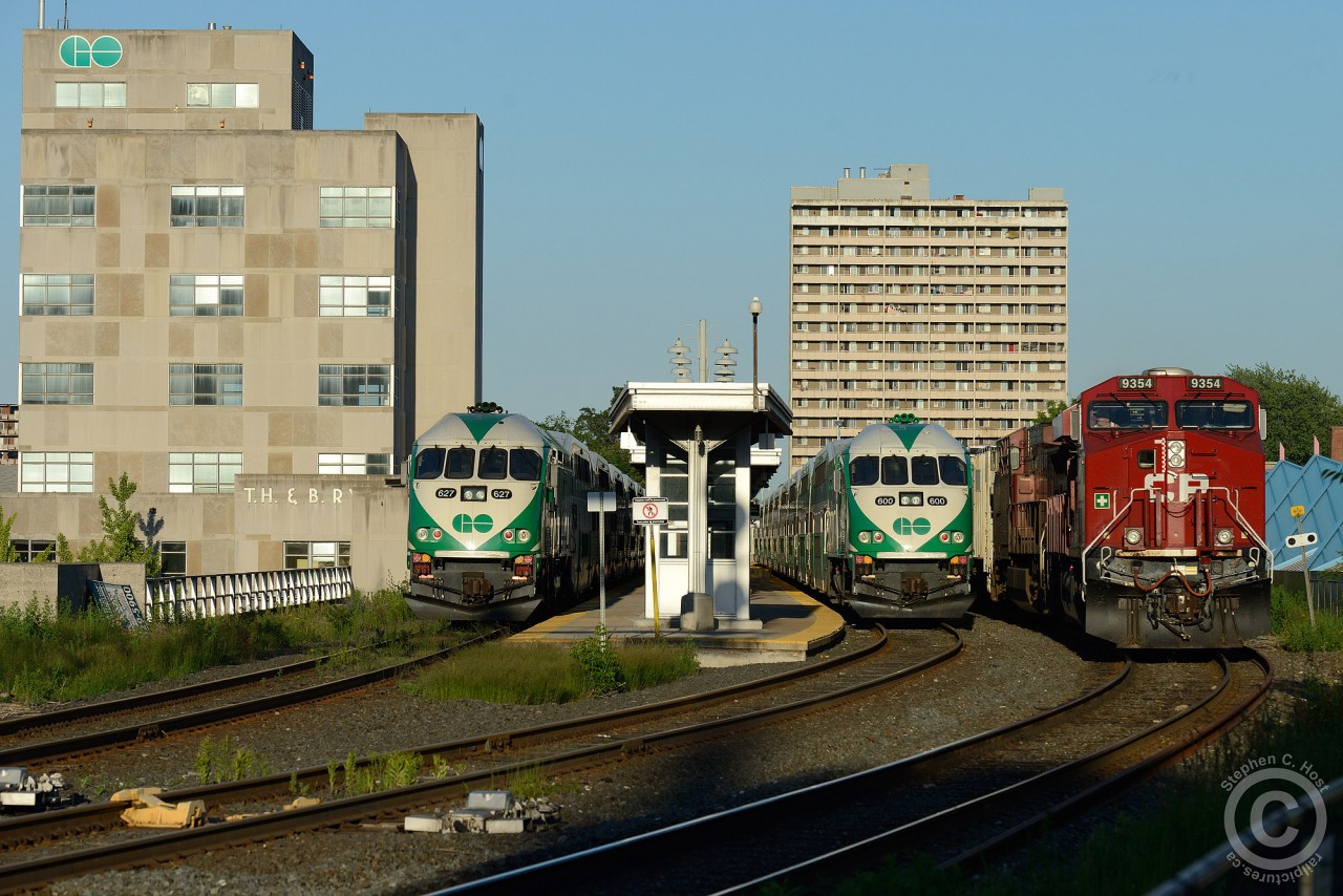 CP Train 255 is passing GO class units #600 and 627 waiting for the Monday morning departure out of the former TH&B Hunter St station.