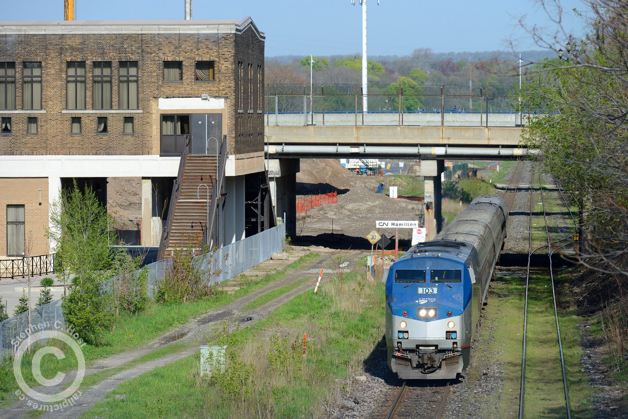 Construction is well under way on the other side of the bridge to finish GO James St. North in time for the Pan-Am Games in summer 2015. The former CN Station at left, built in the 30's and now owned by LIUNA  serves as a banquet hall. The last GO train that called from the former CN station was in 1996. 18 years later, instead of re-using the existing station, GO is spending $30M on a new structure, parking, platforms, and if rumours are to be believed, sound barriers (especially along Stuart St). GO is also building a layover facility at Lewis Rd. in Winona, but the Centennial station is not yet on the books. I would anticipate this new station will serve a temporary layover facility for GO trains until Lewis Rd. is completed in 2015 or 2016, but that's just my guess.