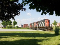CN local 547 has a pair of GP9RMs backing down the Townline spur to a lumber facility. CN still has enough traffic in Milton to justify a daily switch out of Aldershot yard in Burlington.