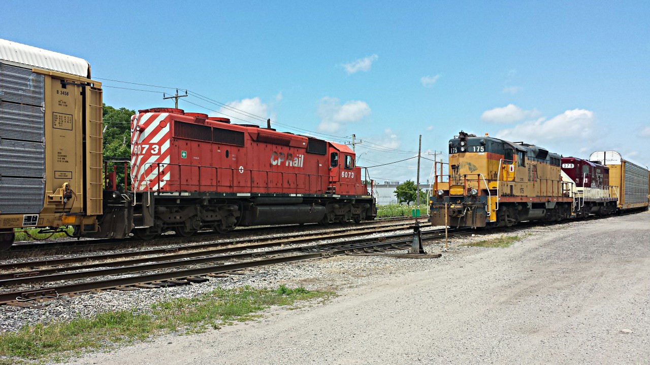 Old meets older with this very rare encounter of an SD40-2 leading a long string of autoracks past the parked OSR power. Thanks dad for bringing me out. :)