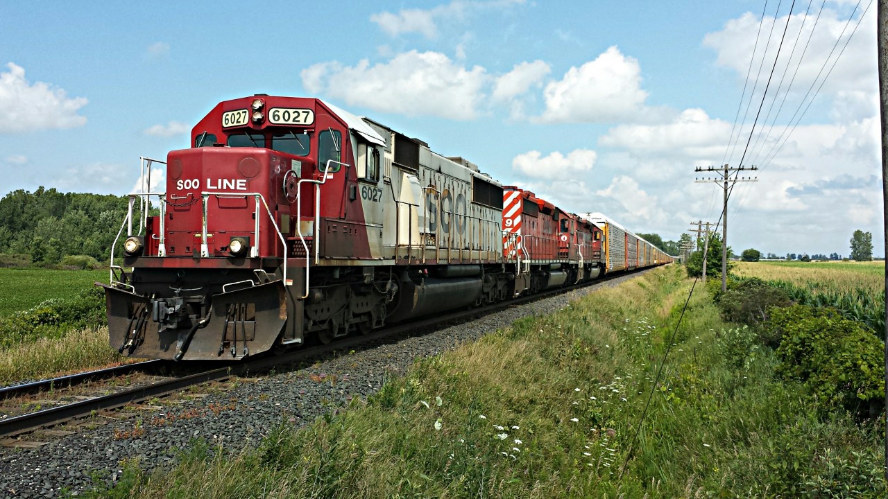 SOO 6027 leads little sisters CP 5919 and CP 6017, in this all EMD consist, westbound approaching Zorra for a meet. Thanks Aivo for the heads up. :)