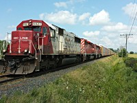 SOO 6027 leads little sisters CP 5919 and CP 6017, in this all EMD consist, westbound approaching Zorra for a meet. Thanks Aivo for the heads up. :) 