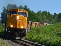 SD75I #2101 leads train 214 round the curve at mile 131 Temagami sub crossing over into Armstrong Twp. 
July 11th 2014