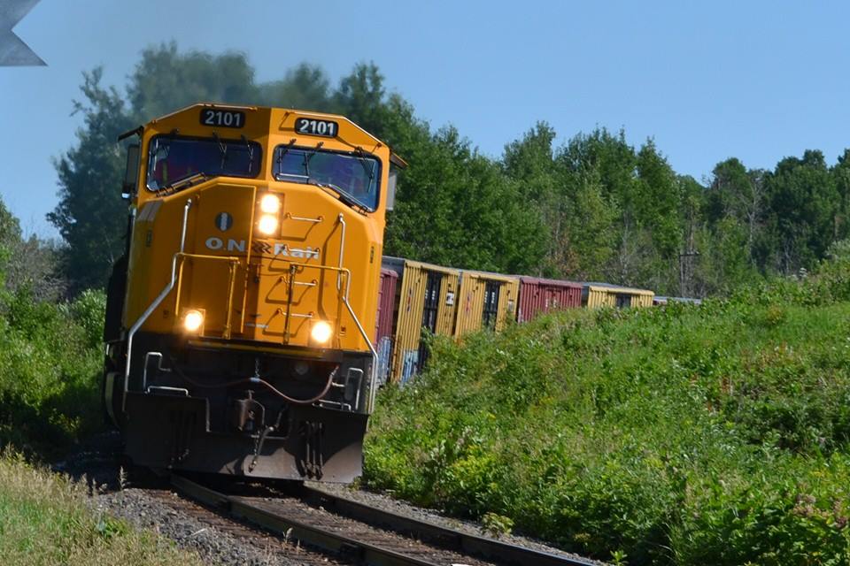 SD75I #2101 leads train 214 round the curve at mile 131 Temagami sub crossing over into Armstrong Twp. 
July 11th 2014
