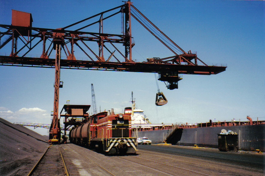 Deep inside the Dofasco steel mill, 414 locomotive spots empty ore cars for loading.  Once loaded they will be delivered to the "Hi-Line" where another locomotive will spot them for unloading at the Blast Furnaces.  
This railway line along the ore dock no longer exists, as ore in now supplied to the Blast Furnaces by conveyor belt from the ore field.