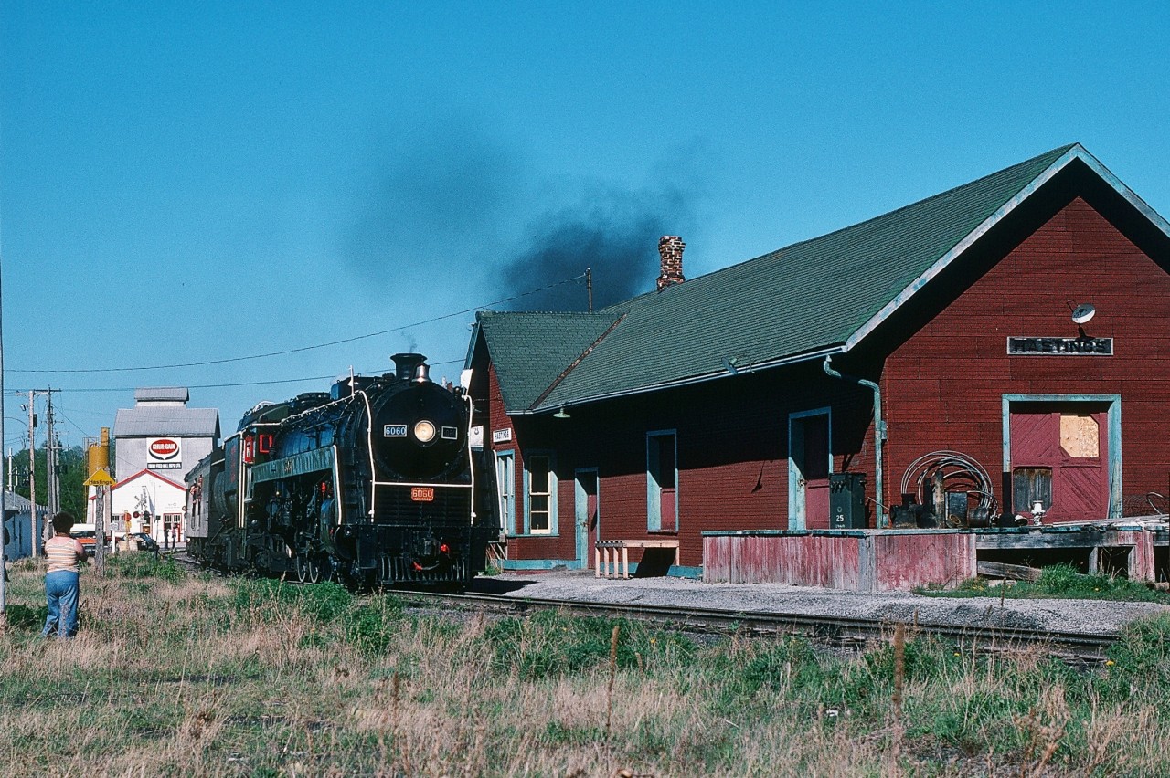 Arnold's Fantastic 6060 shot on the St.Catherines (Welland?) Bridge prompted me to dust off this 1977 action shot.


At one time fans eagerly awaited the late winter/early spring excursion announcements: who was operating what excursions where, etc. 


So, Thirty Seven Years ago.


Not only is this 1944 MLW unique, well ok it was one of eighty U-1 class.


Look at the location.


CN Campbellford Subdivision mile 41.3 Hastings, Ontario.


The CN 'back route' from Belleville to Toronto included 86.4 miles of the Campbellford Subdivision (Belleville through Peterboro to Lindsay)  and  60.9 miles of the Uxbridge Subdivision (Lindsay to Scarboro (CN's spelling) – Junction with Kingston Subdivision. A total of  147.3  miles of interesting branchline railroading – compared to the  Kingston Subdivision's  high speed 113.4 miles .


The back route was a favourite for many 6167 / 6218 excursions. To my knowledge May 7, 1977 was the only date that 6060 rode the Campbellford Subdivision – at the leisurely 40 m.p.h.  speed limit. Stations included Foxboro (mile 6.5), Madoc Jct.(12.2), Anson (mile 19.8 Jct. With Marmora Subdivision), Campbellford (30.9), Hastings (drawbridge at mile 42.0 and the bridge is still in place), Keene (53.7), Peterboro (drawbridge at mile 62.1 and interlocking with C.P. Rail at mile 63.0), Omemee (77.8) and Lindsay. 


 I believe this 6060 excursion was a one way CRHA sponsored trip, consist included several Montreal open window commuter coaches. Perhaps some one out there may recall where this trip originated (Ottawa or Montreal ?). And how riders returned. Anyway it was mid afternoon, about 13:30 by the time the extra west appeared at Belleville.


 To capture this shot I borrowed Dad's black 1969 Pontiac Parrisienne equipped with a 350 cubic inch V8 and Power-glide 2 speed automatic transmission – fuel economy was of little importance – my 1965 Ford LTD equipped with a 352 cubic inch V8 was ailing, cracked frame behind the left rear wheel – happened when changing a tire! Either vehicle was a jack rabbit and two lane country road passing was accomplished with ease.


May 7, 1977 Kodachrome by S.Danko.


What's interesting:


My 65 Ford LTD is visible, lower right, in this shot at Bayview:


    TH&B 71   


CN Campbellford Subdivision mile 2.8 served Corbyville, the location of a distillery and at CN Peterboro two industrial spurs: at mile 60.6 for 0.9 miles south and at mile 63.0 for 2.7 miles south. The Lakefield spur at mile 63.7 extended 9.5 miles north.


CN Campbellford Subdivision speed restrictions: Six axle units in the 2000 and 2300 series restricted to 25 m.p.h. ( the big Alco designed MLW's) and units in series 5000, 5100 and 5200 must not exceed 15 m.p.h.  (the six axle SD's – perhaps given the SD's  trucks long wheel base).


More 6060


    CN 6060 at Sunnyside  


    CN 6060 at Sunnyside  


    CN 6060 at Washago  


    CN 6060 near Newtonville  


    CN 6060 near Trent River Drawbridge   


sdfourty