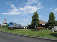 
The 694 passing the old station in downtown St-Jean , on way to New York city !