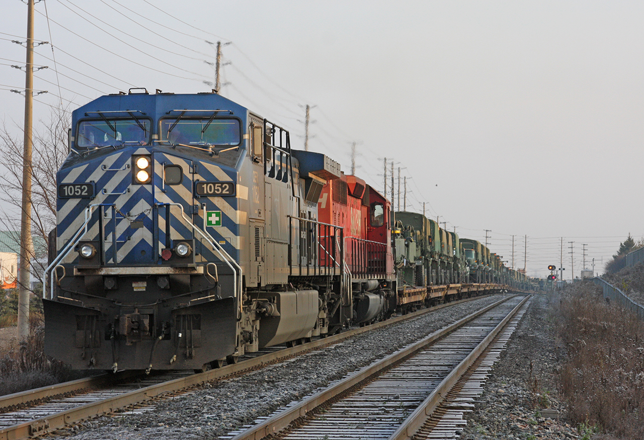 The Armoured train, CEFX 1052 and STL&H 5651 take charge on this westbound Military train.