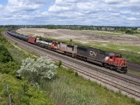 710 crawls through Whitby with an oddball all-EMD lash up.