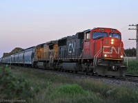 Five minutes to sunset, though it's already dropped into the ether, CN 5754 and 2031 make time with 377's train at Lovekin. 2056hrs.