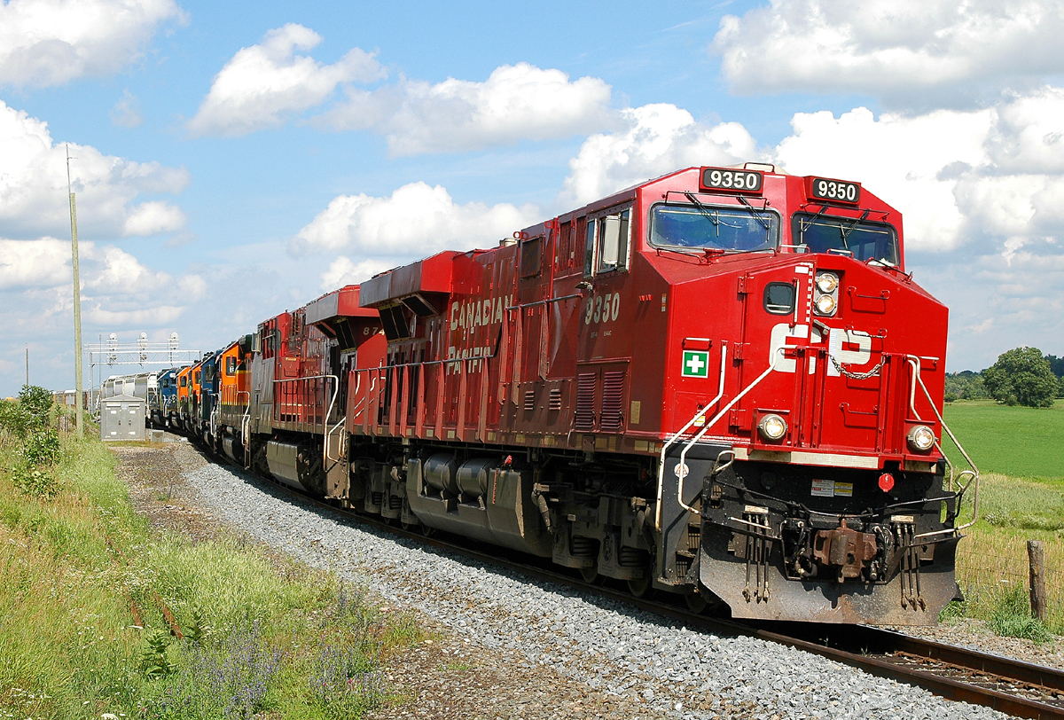 255 departing Wolverton with CP 9350 - CP 8749 - HLCX 7860 - HLCX 8147 - HLCX 8145 - HLCX 7014 - HLCX 7843 - HLCX 7180 and 123 cars