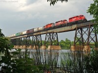 Accelerating across the Trent River, CP 5690, 5975, and 5872 hustle 241's 60 car train west at Trenton, Ontario. Often sporting a single GE, the trio of SD40-2's were probably appreciated on this 241, if for no other reason, than their faster pace accelerating from slows, stops, and of course, up hills. 1841hrs.