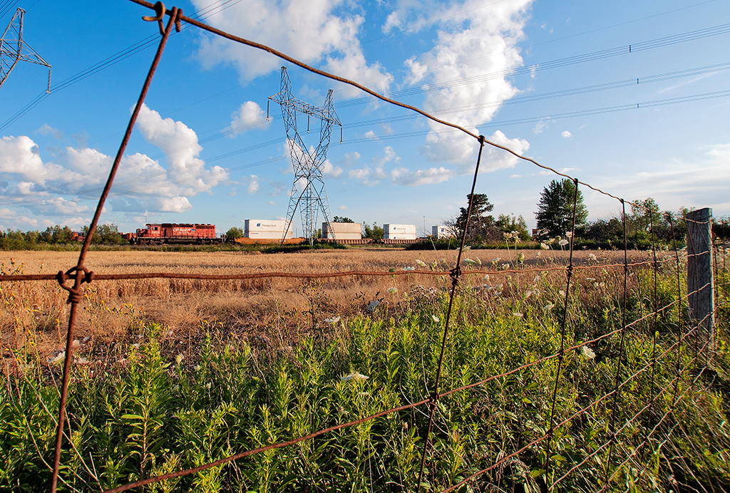A single SD40-2 serves as the yard switcher at Vaughan to build, separate trains. CP 5835 sits on the north leg wye track with a block of intermodal that will be a part of CP 101's train build in a few moments.