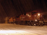 CP 9160 South with 116's freight stopped in track 2 at 20:05 for a new crew, during some snow fall in MacTier.