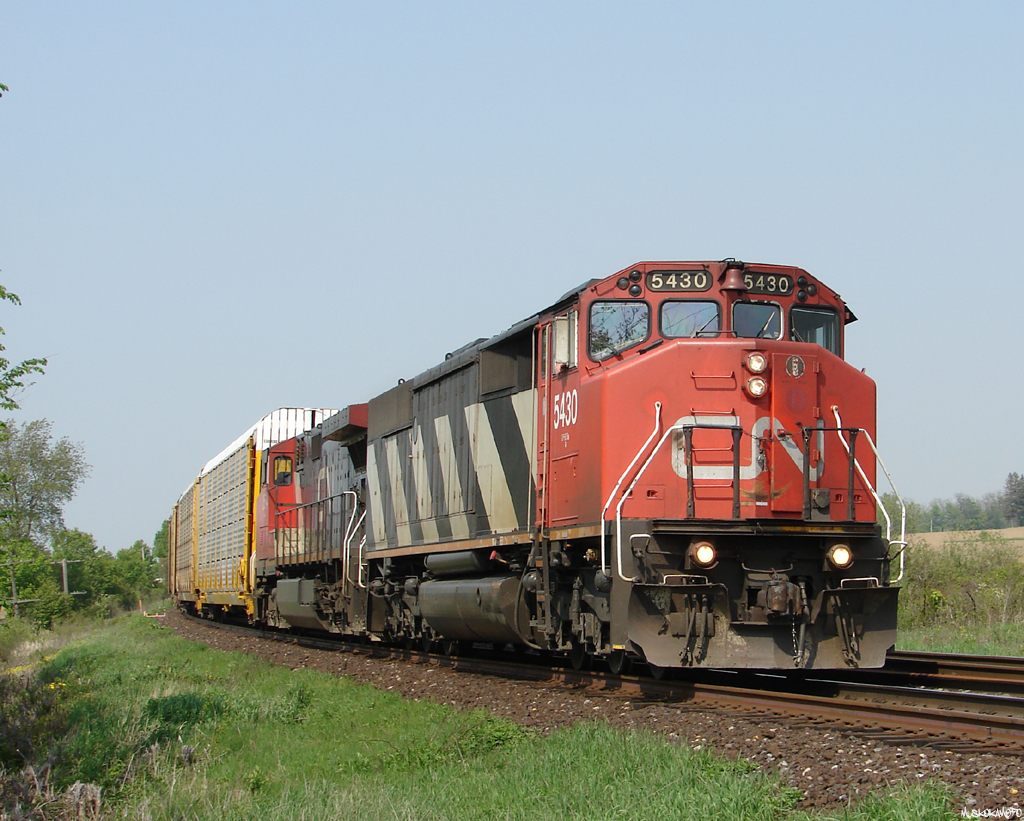 CN 271 - CN 5430 West seen at Powerline Road approaching Brantford not far behind 393. In 2007 I remember being disappointed every time I'd see an SD50F come into view, in 2014 I would much rather shoot another SD50F leading than the SD60's that now dawn the 5400 slot on the roster!